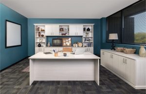 White cabinets and desk in blue home office