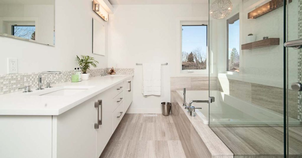 bathroom with cabinets and a glass walk-in shower