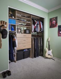 Reach-in closet system in bright green kids' room