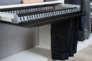 Pants hanging from rack