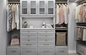 Light gray walk-in closet system with women's clothing