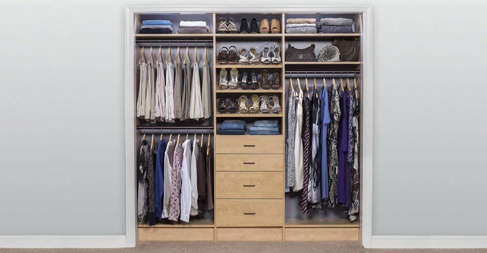 Reach-in closet with natural wood organizer system