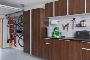 Garage organization system with workbench, cabinets, and wall storage