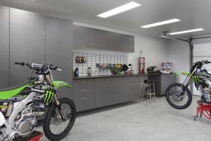 Garage organization system surrounded by dirt bikes
