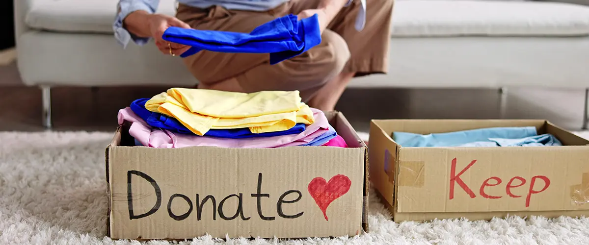 decluttering a closet and donating clothes