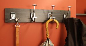 Accessories and jacket hanging on coat rack