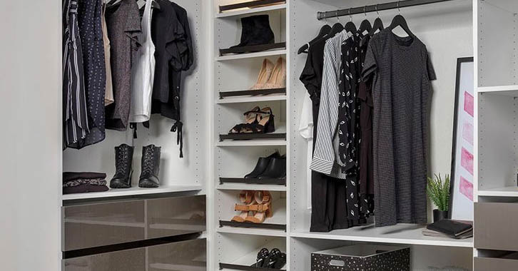 A closet with clothes and shoes