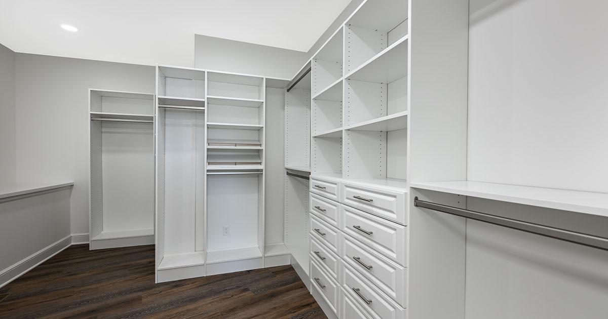 Large custom closet with white cabinets