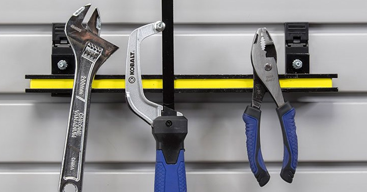 Tools in a garage held by an organizing accessory