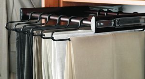 Pants on hanging rack in closet