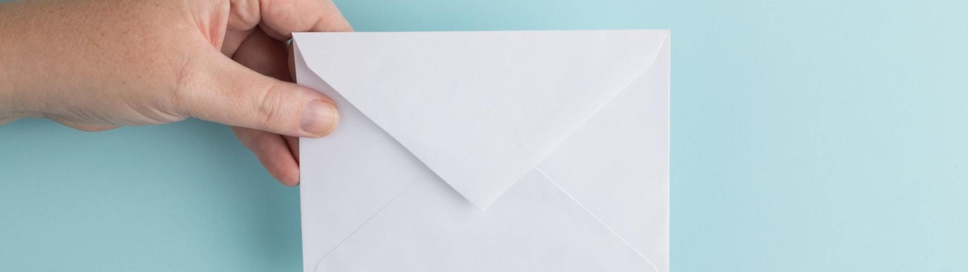 Hand Holding an Envelope