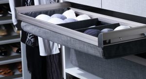 Socks organized in divided closet drawer