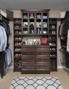 Closet organization system with drawers, shelving, and shoe racks