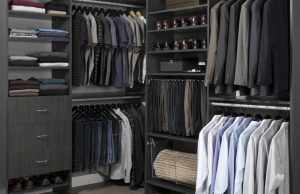 Black closet organizer system with men's clothes