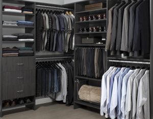 Black closet organizer system with men's clothing