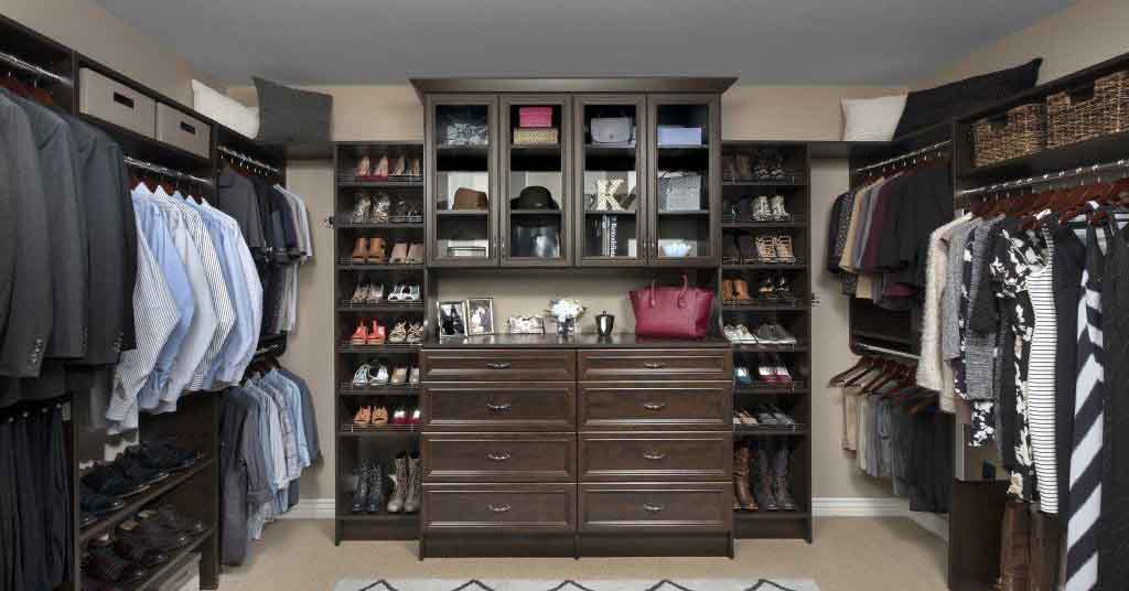 A large walk-in closet with custom cabinets