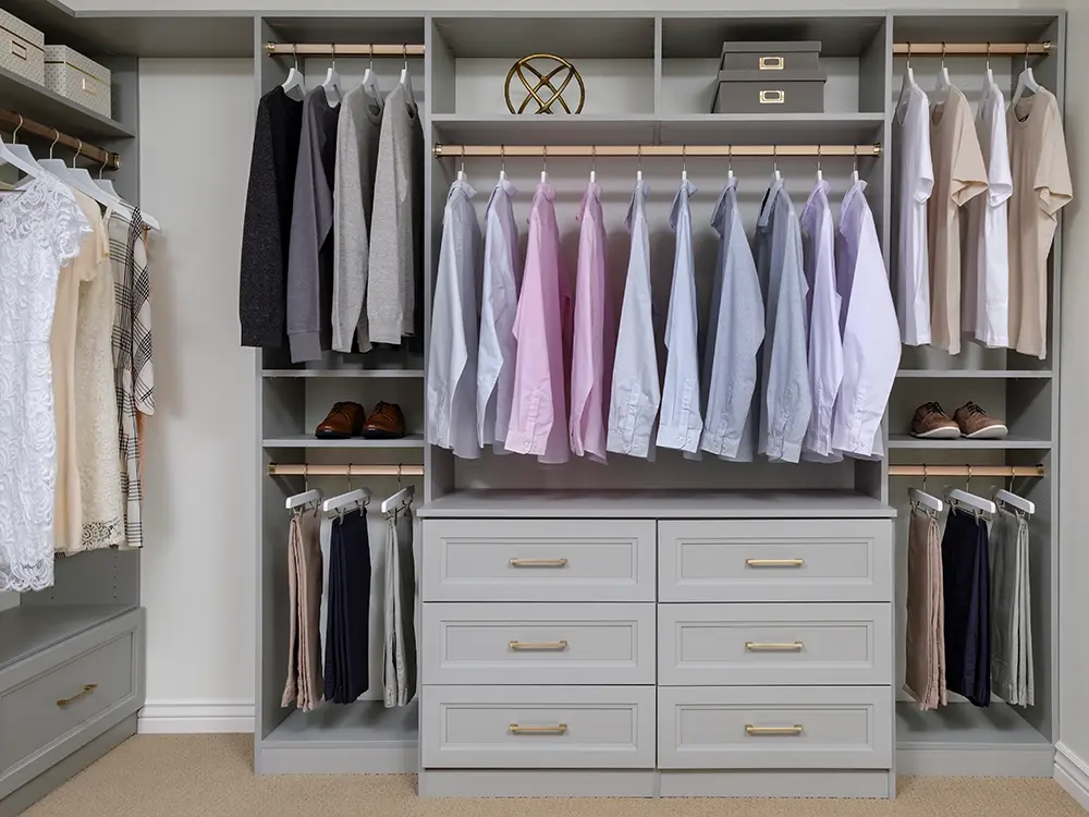 custom closet newly installed with well organized shirts and other clothes