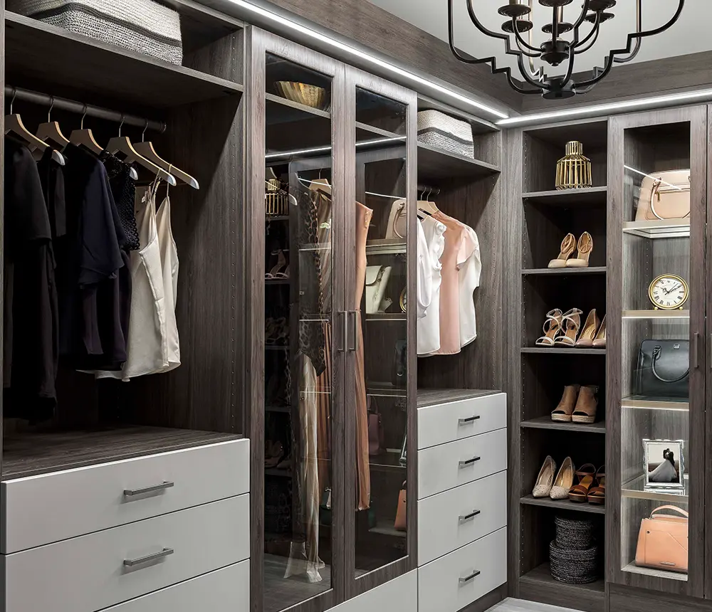 custom closet in a corner of a modern room filled with clothes