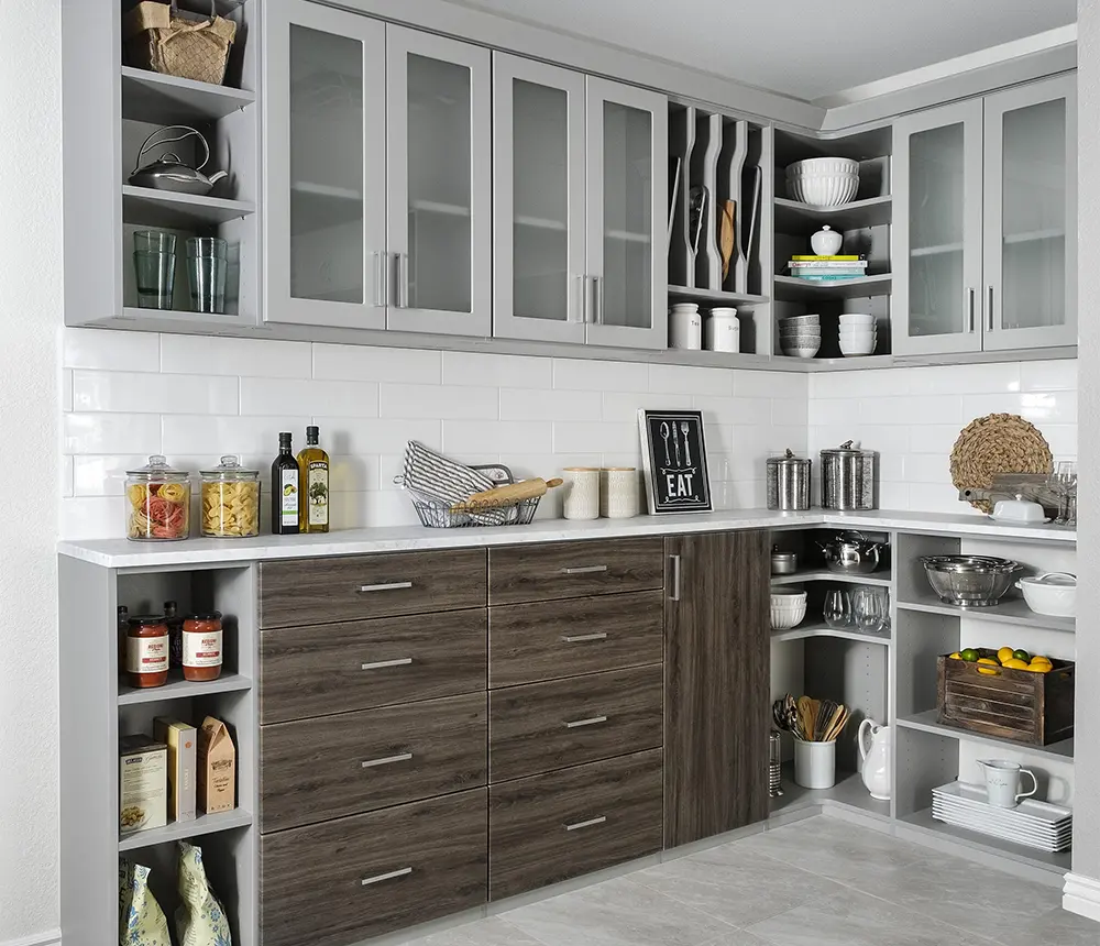 newly built kitchen pantry with brown and white cabinetry