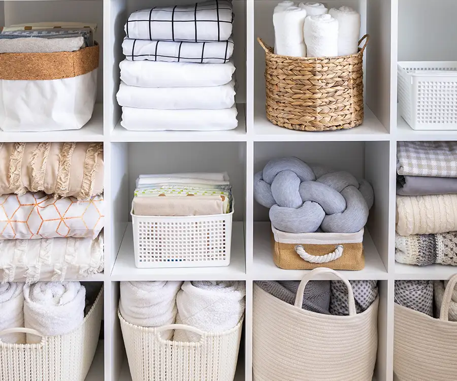 shelves from linen material and lots of towels shelved