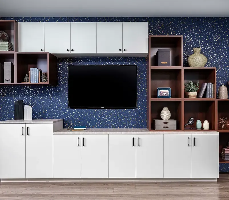office space room for teenagers with blue navy walls and white cabinets