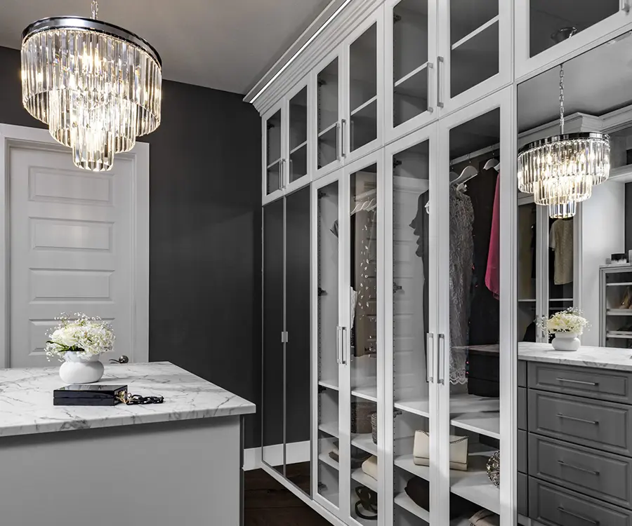modern walk in closet with white and brown shelves