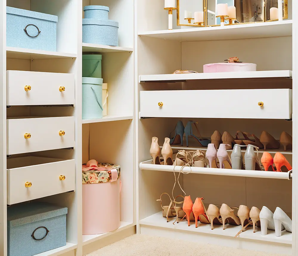 women closet with lots of shoes and pastel colors shelves and doors