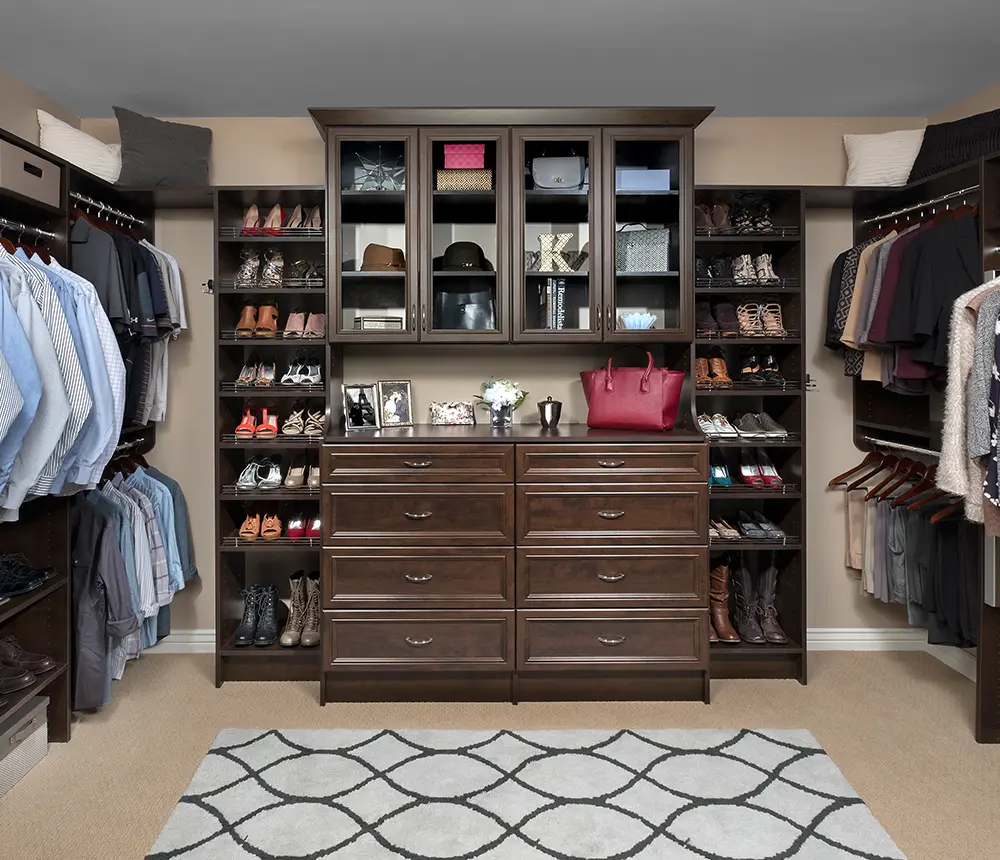 big dark brown wood closet in large room well organized