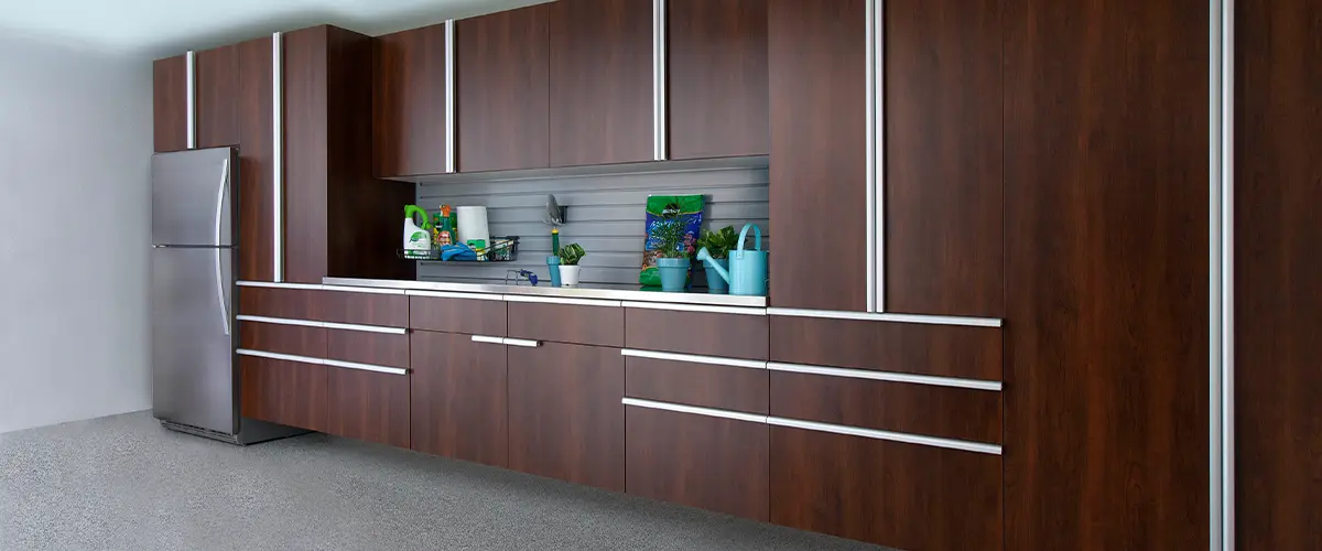 Large brown garage cabinets with a worktop