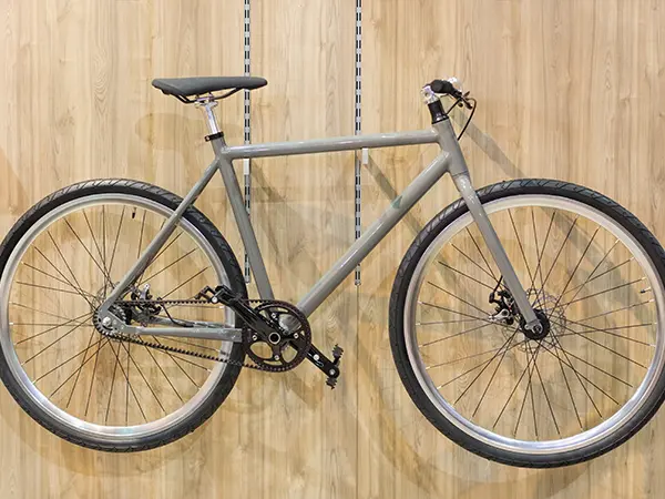 A bike rack on a garage wall