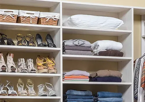 Closet shelving with clothes and shoes