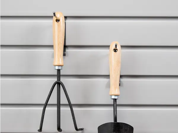 Garage hooks on walls for various gardening tools