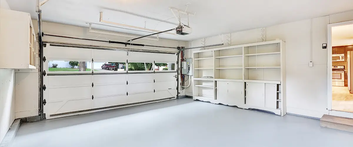 A white garage with some cabinets