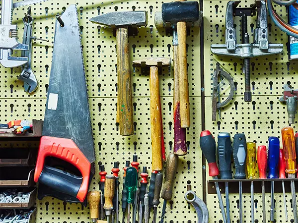 A slat wall used to hang tools