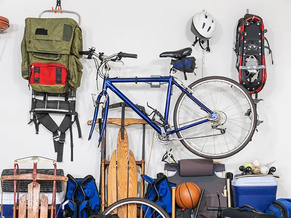 A bike, helmet, backpack, and, and more equipment for sports