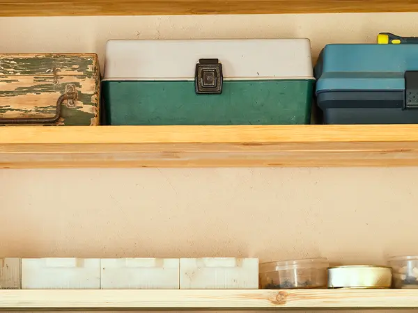 Storage bins on wood shelves