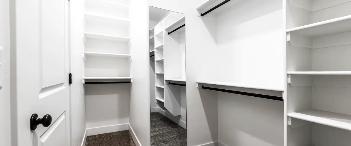 Modern White Walk In Closet Interior With Open Shelves