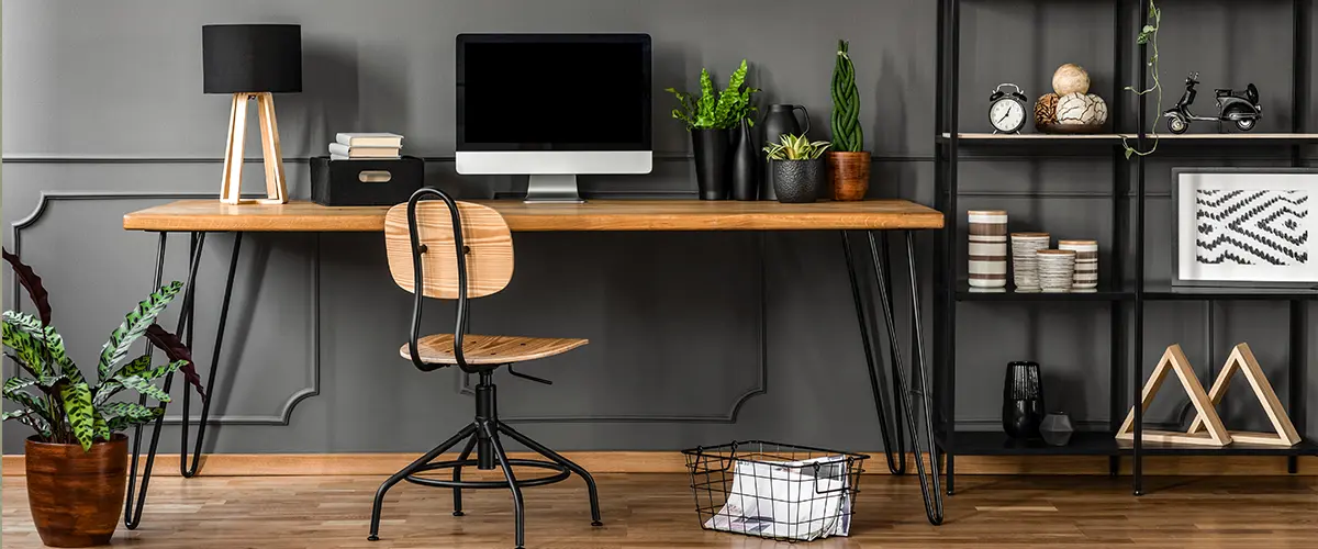 Minimalist office with grey charcoal wall.