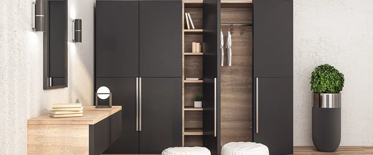 Modern wardrobe with clothes in stylish interior